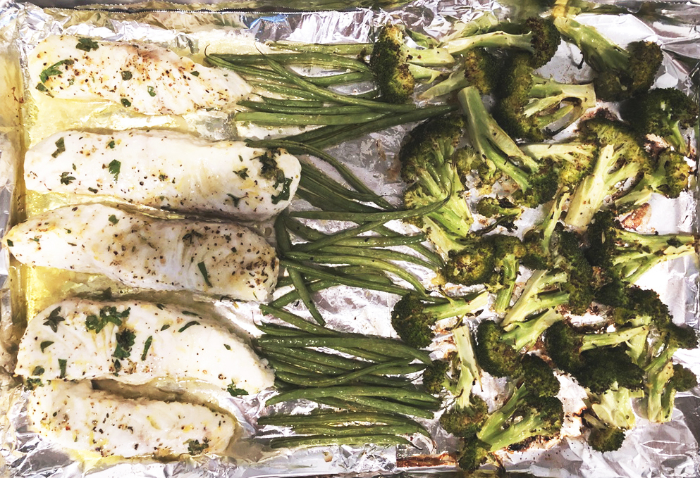 Halibut and vegetables on roasting pan 