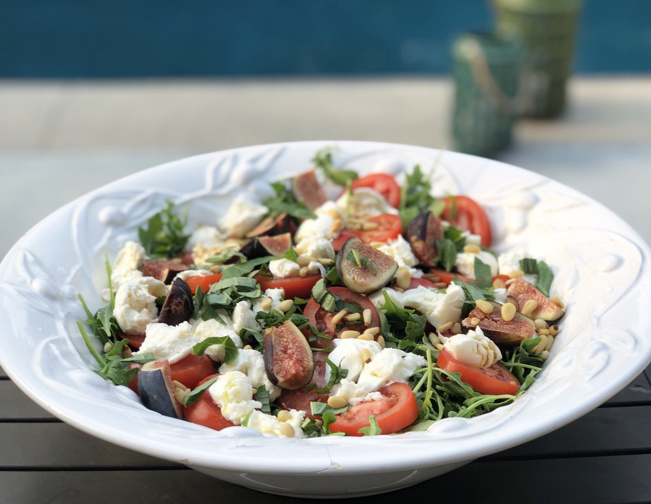 Tomato, Mozzarella and Fig Salad on a bed of arugula