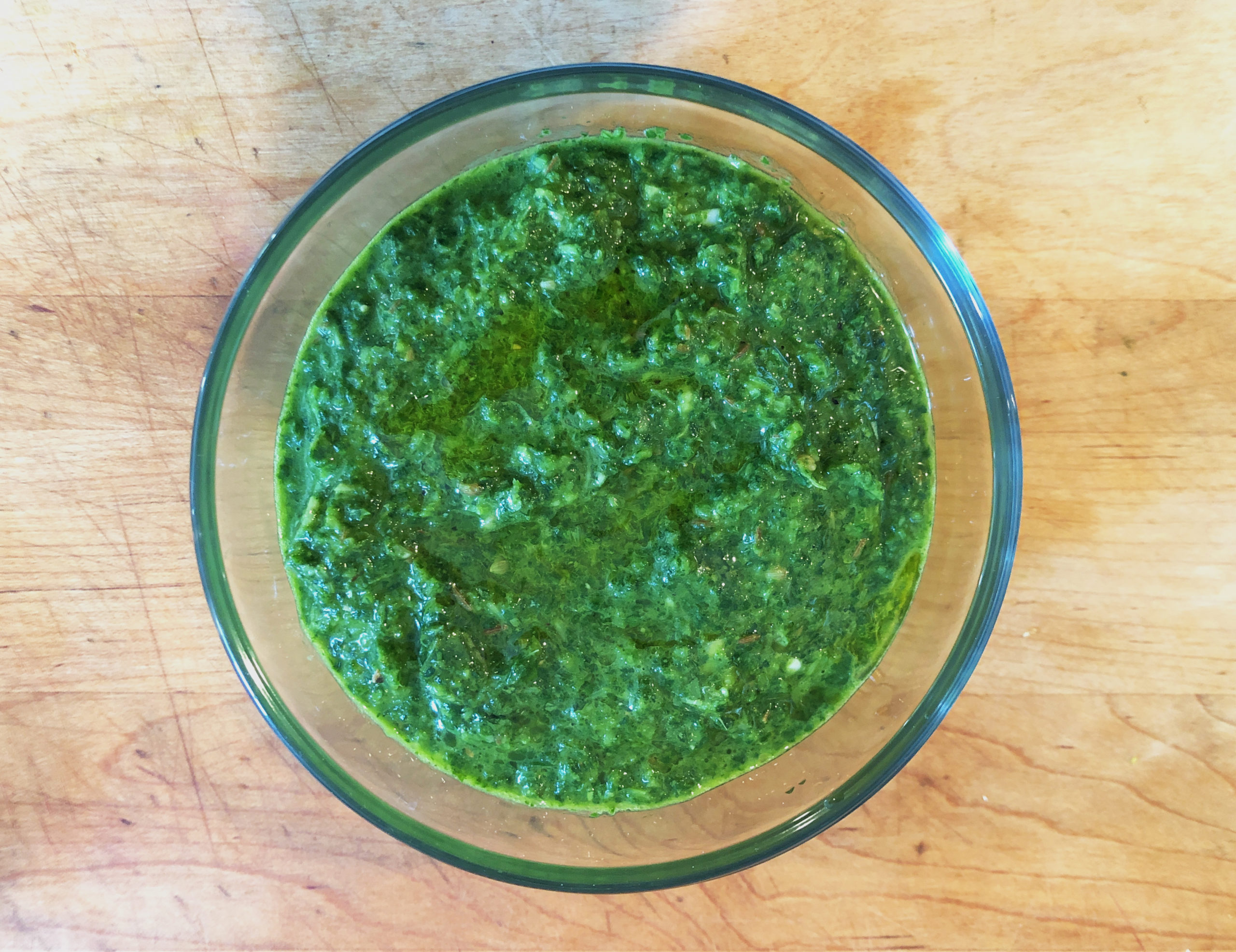 A bowl of Green Shug Hot Sauce